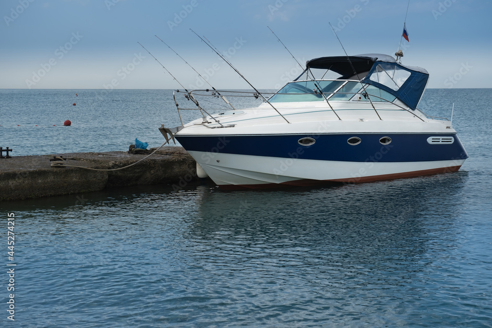 The boat is at the pier in the resort village of Nebug, Krasnodar Territory The boat is at the pier in the resort village of Nebug, Krasnodar Territory