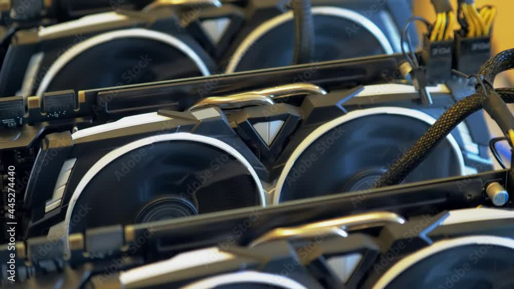 Cryptocurrency mining. GPU at work. Working graphic video cards for e-currency. Computer for Bitcoin and cryptocurrency mining. Crypto farm. Mining of crypto-currencies. Farm from video cards. Cryptocurrency mining. GPU at work. Working graphic video cards for e-currency. Computer for Bitcoin and cryptocurrency mining. Crypto farm. Mining of crypto-currencies. Farm from video cards.