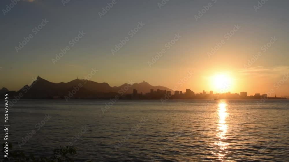 sunset in Baía de Guanabara with boats passing by sunset in Baía de Guanabara with boats passing by