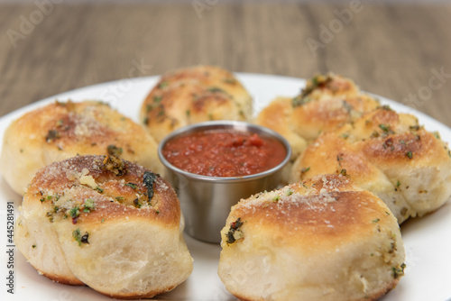 Εκτύπωση καμβά Side dish appetizer of garlic flavored bread rolls on a plate served with marina