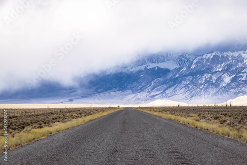 Canvas Print A long, straight road heading into the distant mountains in Idaho