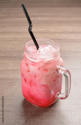 Photography Thai ice milk tea or coffee bandung with boba bubble pearl in glass jar and stra