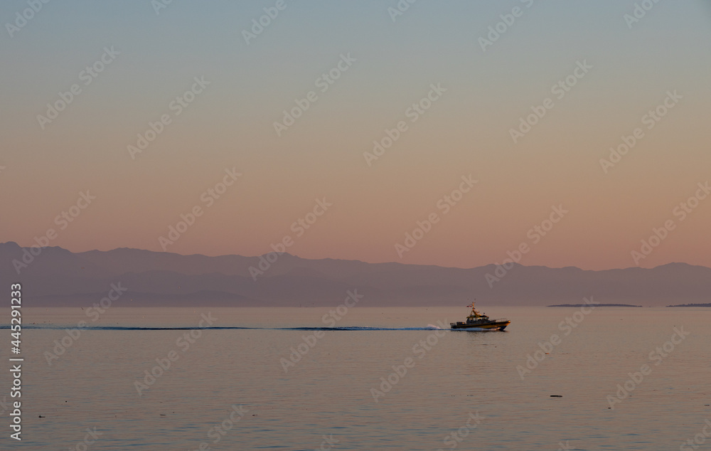 Boat cruising at sunset