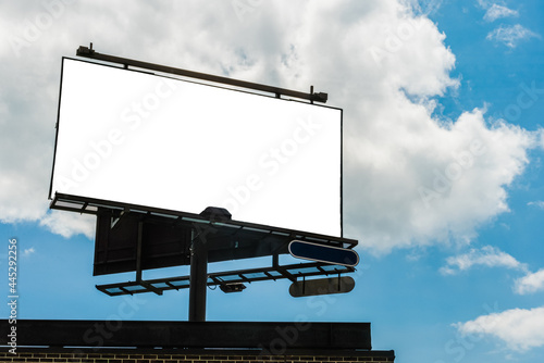 Billboard blank for advertisement, sunny day. Bright sun - cloud day background - template, copy space.
