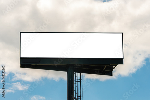 Billboard blank for advertisement, sunny day. Bright sun - cloud day background - template, copy space.