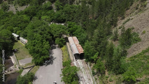 Aerial View of Sargan Eight Train Station, Mokra Gora, Serbia. Old Narrow Gauge Railway, Now Tourist Attraction, on Sunny Summer Day photo