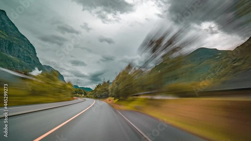 Dashcam view. Driving on the narrow rural road and then through the streets of the Sunndalsora, Norway. Road 70 photo