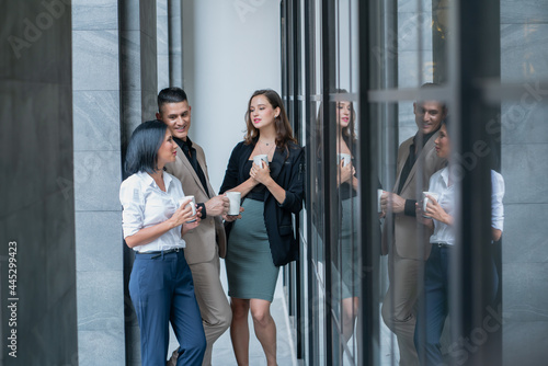 Group of Business People Enjoying Coffee while Standing in Urban at Breaking time. © Me studio