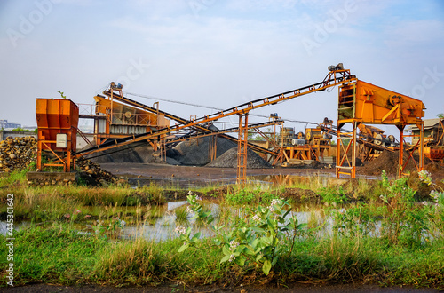 Sand mine escalator. Industrial equipment in the nature. Heavy tool for mine 