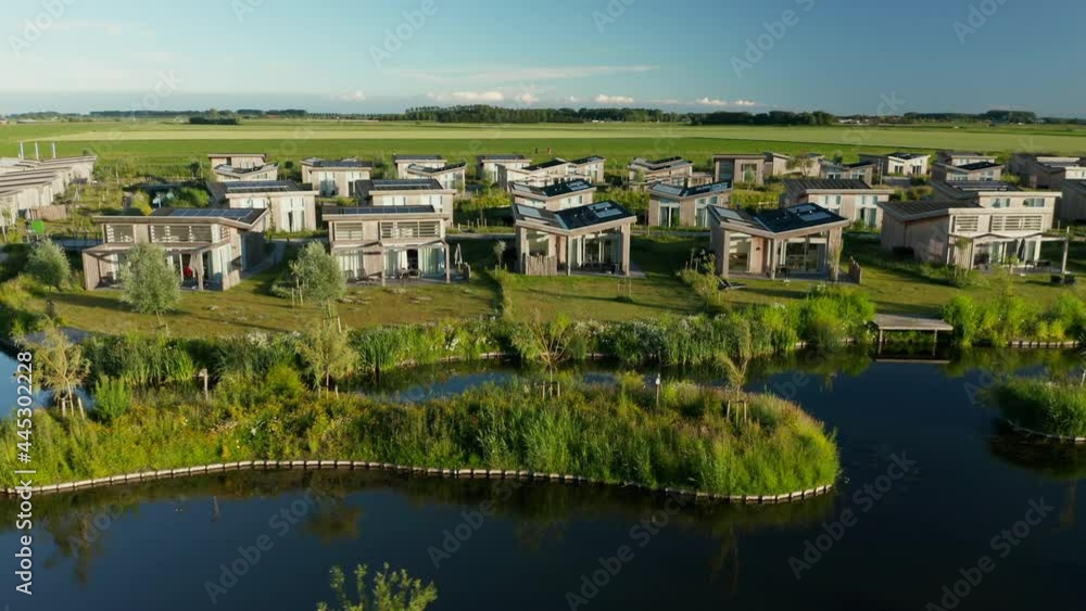 Holiday Resort Houses With Neutral Energy Source At Roompot Water Village In Zeeland, Netherlands. aerial drone Holiday Resort Houses With Neutral Energy Source At Roompot Water Village In Zeeland, Netherlands. aerial drone
