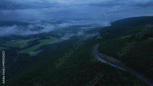 Aerial drone video footage of a scenic highway in the Appalachian mountains during summer. This is in the Shawangunk Mountains which are a subrange of the Appalachians in new York's Hudson valley.  photo