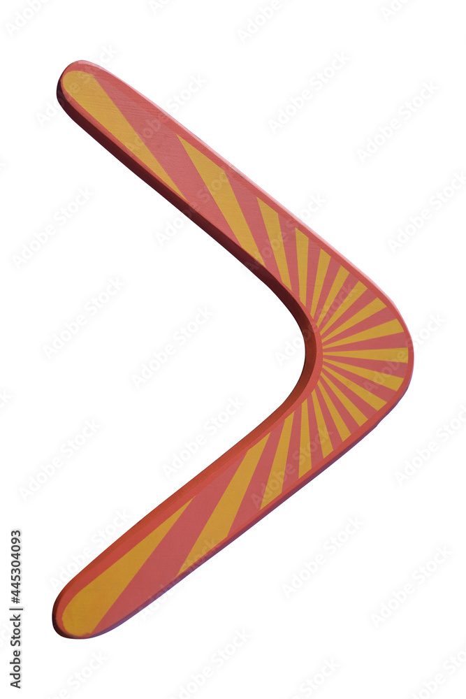 Wooden australian boomerang in flight against of pure white clouds and blue sky Wooden australian boomerang in flight against of pure white clouds and blue sky