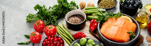 Selection of healthy food on light gray background. Clean eating concept.