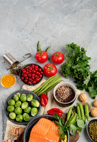 Selection of healthy food on light gray background. Clean eating concept.