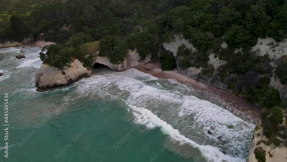 Aerial view of cave on the sandy beach, beautiful and wild nature scenery of New Zealand. Cathedral Cove Aerial view of cave on the sandy beach, beautiful and wild nature scenery of New Zealand. Cathedral Cove