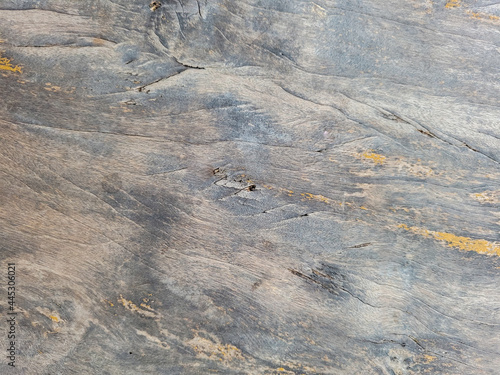 Old wooden background with natural texture and weathered cracks.