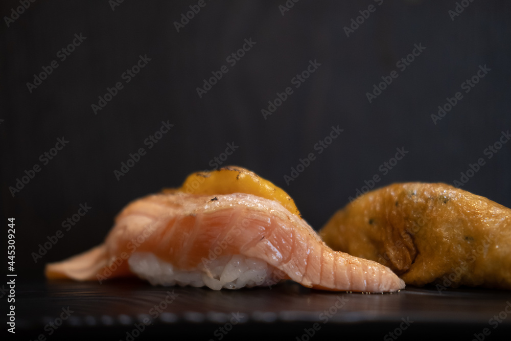 Delicious sushi salmon on black background. Delicious sushi salmon on black background.