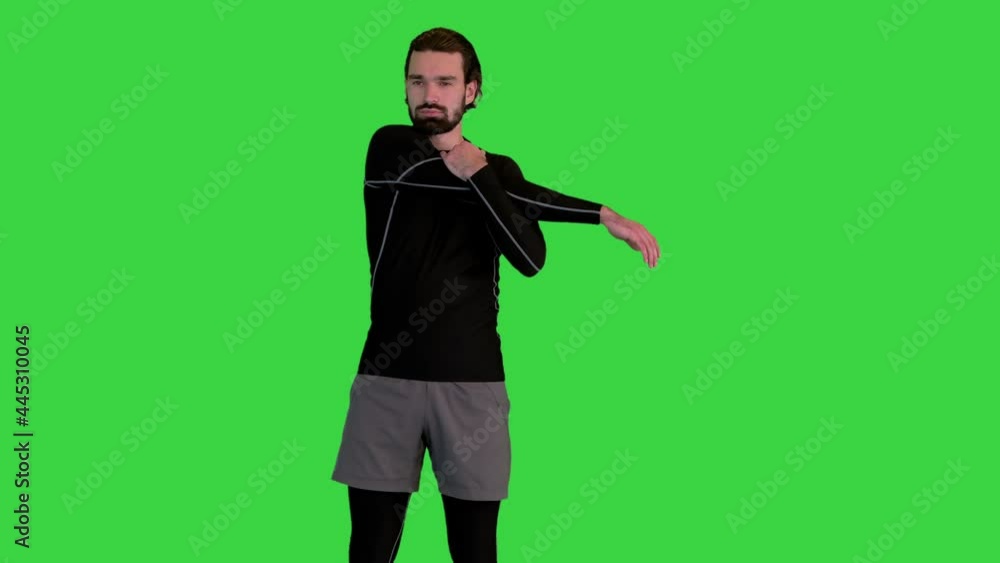 Sporty fitness man warming up on a Green Screen, Chroma Key. Sporty fitness man warming up on a Green Screen, Chroma Key.