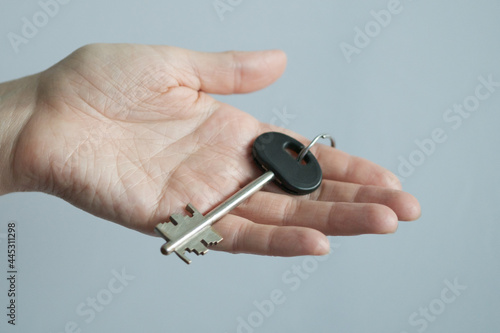 Door key in hand.