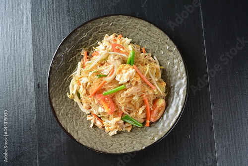 stir fried noodle vermicelli with seafood phad Thai on wood background asian halal menu