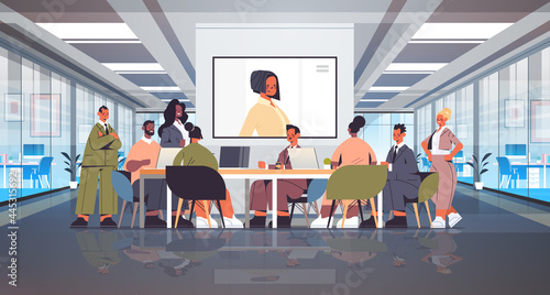 businesspeople having online conference mix race business people discussing with businesswoman during video call