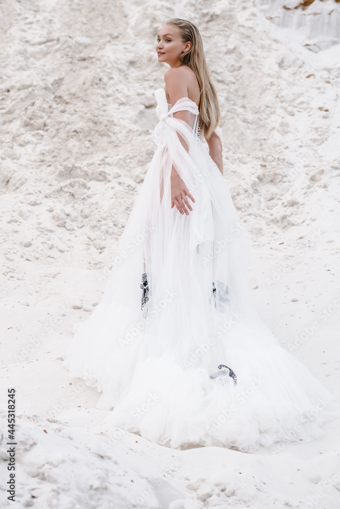 Beautiful wedding couple bride and groom at wedding day outdoors at ocean beach. Happy marriage couple o