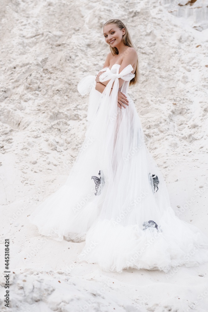 Beautiful wedding couple bride and groom at wedding day outdoors at ocean beach. Happy marriage couple o Beautiful wedding couple bride and groom at wedding day outdoors at ocean beach. Happy marriage couple o