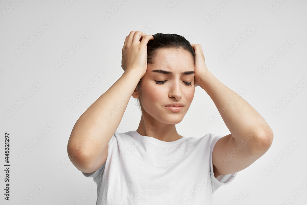 woman in white t-shirt emotion displeasure headache health problems woman in white t-shirt emotion displeasure headache health problems