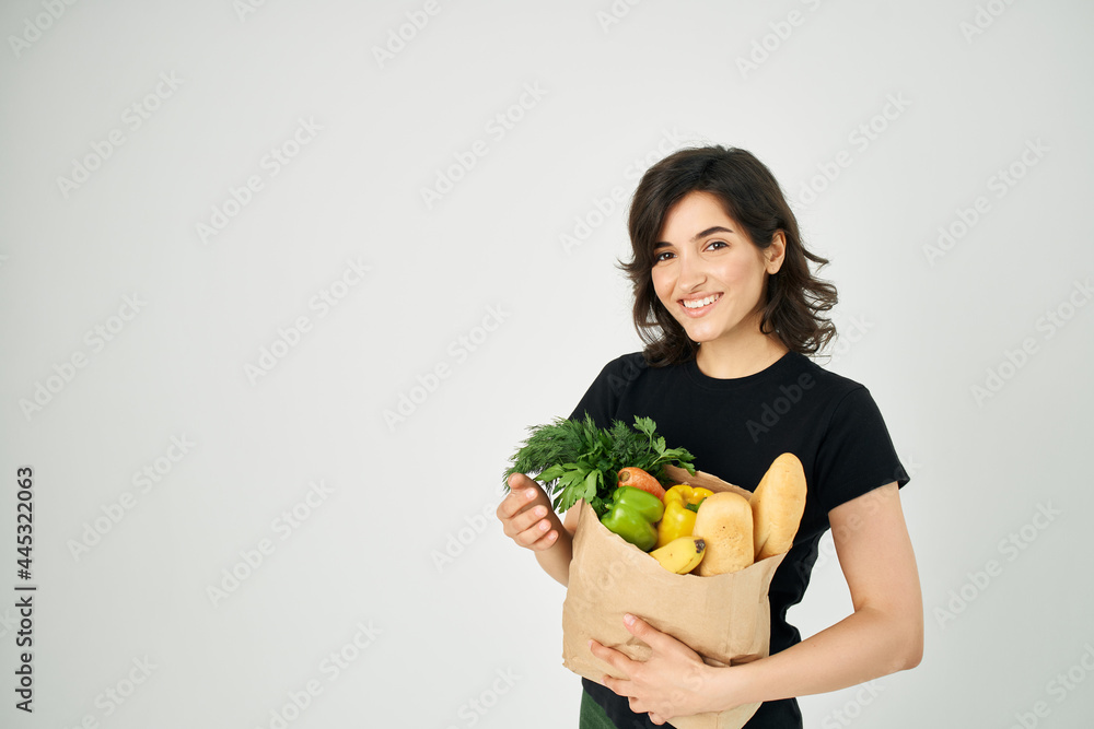 pretty woman with food package healthy food vegetables light background pretty woman with food package healthy food vegetables light background