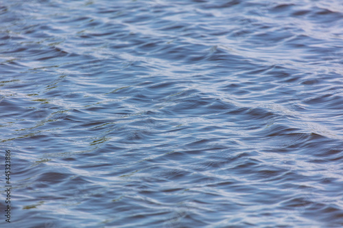 The smooth surface of the water in the lake as an abstract background.