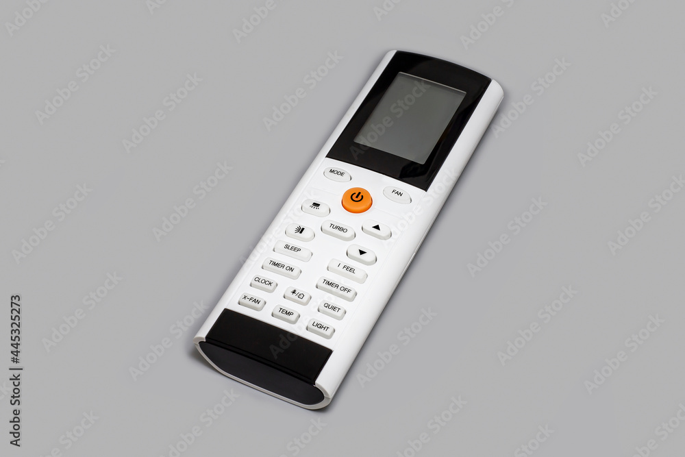White air conditioner remote on gray background.
White air conditioner remote on gray background.