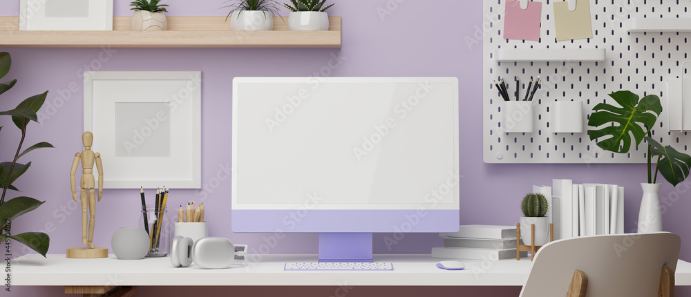 Work space in purple wallpaper design with desktop computer, decoration  stuff and copy space Stock Photo