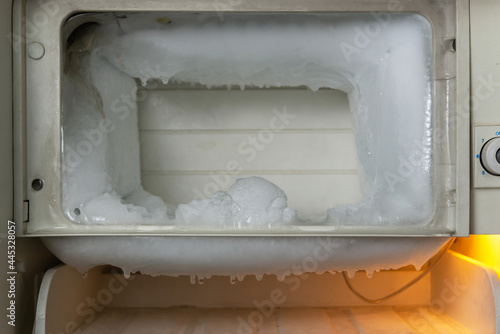 Schilderij op canvas Ice on freezing compartment of  old refrigerator, copy space for text
