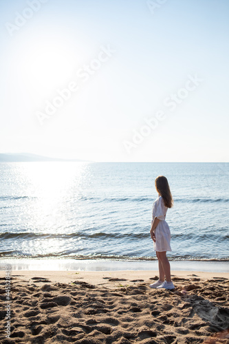 young woman admires the beauty of the sea © Liubov Kartashova