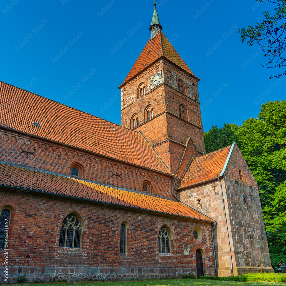 Alexander church in Wildeshausen with green trees and blue sky Alexander church in Wildeshausen with green trees and blue sky