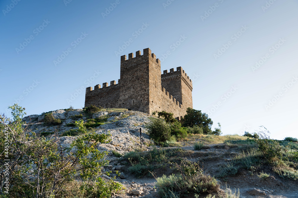 During the day, on the rock there is a fortress from the Middle Ages, the Genoese fortress