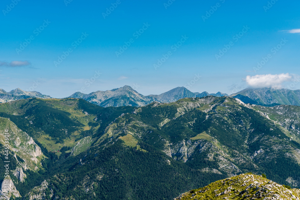 Retezat mountains from Coada Oslei hill on Oslea mountain ridge in Valcan mountains in Romania