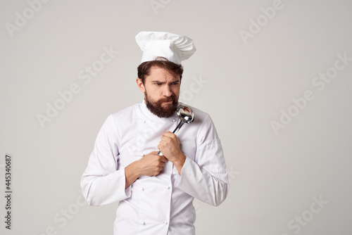 man preparing food with a saucepan in his hands chef professional kitchen work