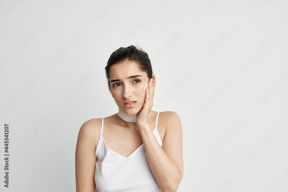 woman with head pain bandage around her neck health problems migraine woman with head pain bandage around her neck health problems migraine
