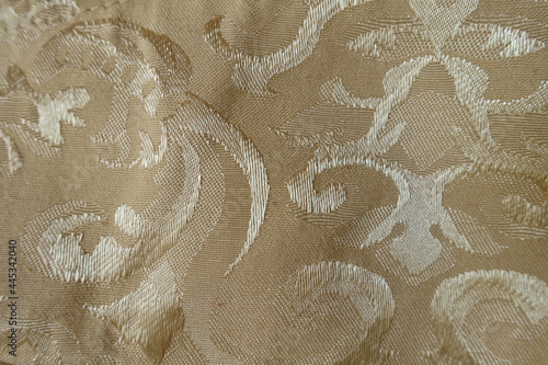 Texture of old fashioned beige damask jacquard fabric photo