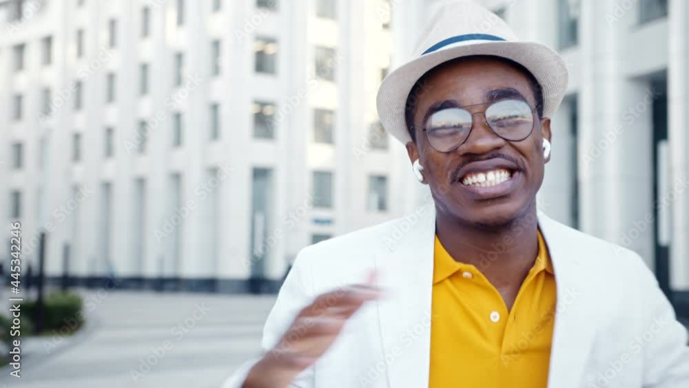 Joyful black performer in glasses with white toothed smile Joyful black performer in glasses with white toothed smile