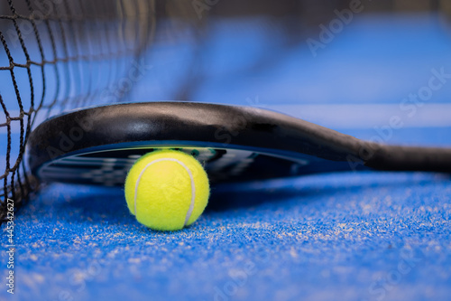 Close up padel or tennis racket and ball © damianobuffo
