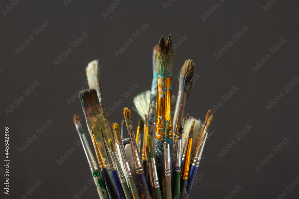 Dirty Paint brushes closeup on gray background Dirty Paint brushes closeup on gray background