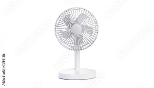 Battery powered white table fan isolated on white background with clipping path. portable battery fan photo