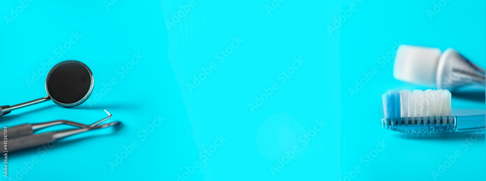 Month mirror and periodontal probe, Toothbrush and toothpaste on large ...