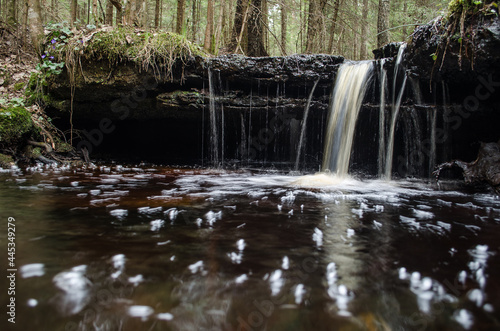 Long exposure waterfall on small river Olupite in Renda, Latvia.