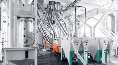 Modern electrical mill machinery for production of wheat flour. Equipment Factory Grain photo