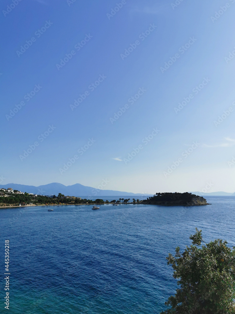 Nice view of the mountains and the blue sea on a sunny day. Kusadasi, Turkey.