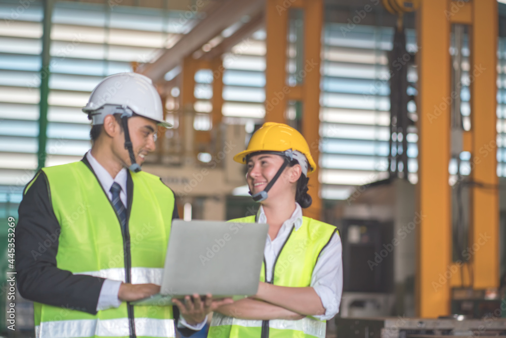 Asian Engineer working in factory .Teamwork ,Unity Concept. Asian Engineer working in factory .Teamwork ,Unity Concept.