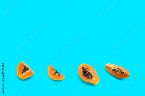 Papaya fruit on blue background.